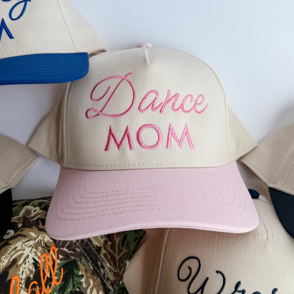 Pink cap with 'Dance Mom' text on a white background