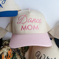 Pink cap with 'Dance Mom' text on a white background